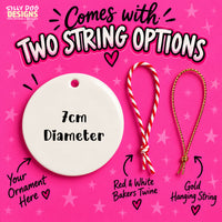Promotional graphic for an ornament string option, showing a white round ornament labeled '7cm Diameter' on a bright pink star background. Text reads 'Comes with TWO STRING OPTIONS' and shows two hanging strings: a red-and-white bakers twine loop and a gold hanging string, with placeholder text 'Your Ornament Here'.