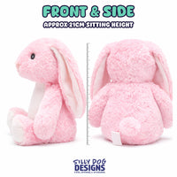 A pink plush bunny shown from the front and back on a white background, with text reading 'FRONT & SIDE' and 'APPROX 21CM SITTING HEIGHT' plus a ruler for scale. The Silly Dog Designs logo appears at the bottom.