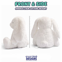 A white plush bunny shown from the front and side on a white background, with text indicating approximately 21 cm sitting height and a ruler between the two views. The brand name 'SILLY DOG DESIGNS' appears at the bottom.