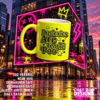 A large neon yellow ceramic mug with the text 'Dyslexics Are People Poo' in black, shown floating in front of a city building at night with pink neon graffiti. Product text at bottom left lists material and safety claims, and the 'SILLY DOG DESIGNS' logo appears at bottom right.